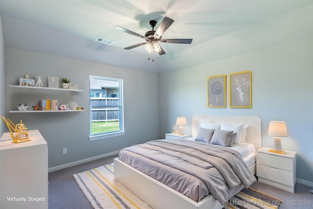 bedroom with carpet flooring, baseboards, and a ceiling fan