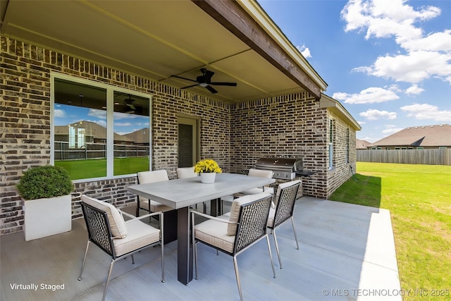 view of patio featuring ceiling fan, area for grilling, outdoor dining area, and grilling area