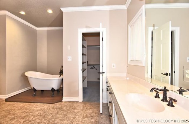 8734 S Richmond Ave, Tulsa, OK 74137 - full bath featuring vanity, crown molding, a freestanding bath, recessed lighting, and baseboards