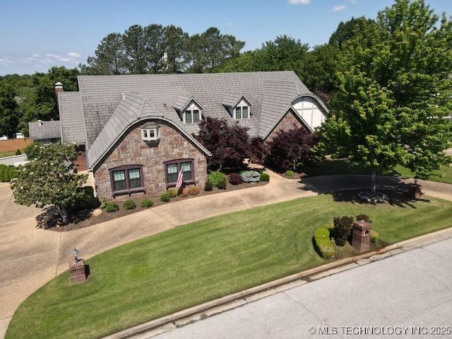 8734 S Richmond Ave, Tulsa, OK 74137 - view of front of home with stone siding and a front yard