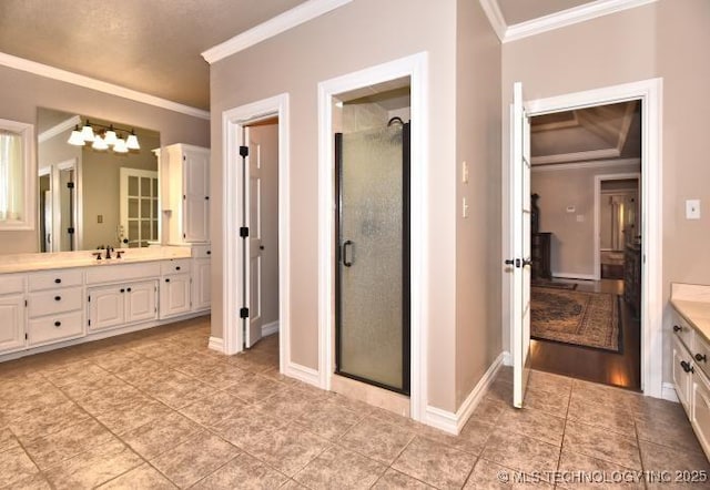 8734 S Richmond Ave, Tulsa, OK 74137 - full bath with ornamental molding, vanity, a stall shower, tile patterned flooring, and a chandelier