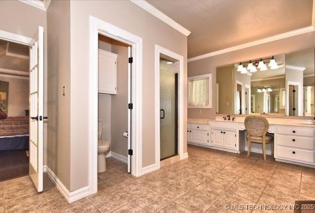 8734 S Richmond Ave, Tulsa, OK 74137 - ensuite bathroom with crown molding, vanity, toilet, a shower stall, and tile patterned floors