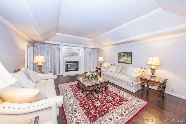 8734 S Richmond Ave, Tulsa, OK 74137 - living area featuring a raised ceiling, wood finished floors, a fireplace, crown molding, and baseboards