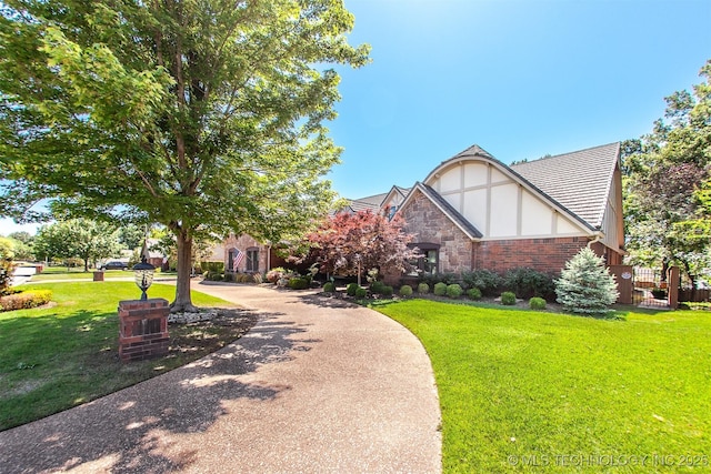 8734 S Richmond Ave, Tulsa, OK 74137 - view of front of house with stucco siding and a front lawn