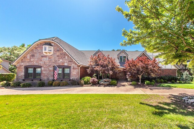 8734 S Richmond Ave, Tulsa, OK 74137 - view of front of property featuring a front yard and stone siding