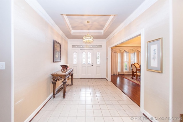 8734 S Richmond Ave, Tulsa, OK 74137 - entryway featuring a chandelier, crown molding, baseboards, a raised ceiling, and light tile patterned flooring