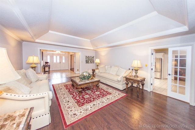 8734 S Richmond Ave, Tulsa, OK 74137 - living area featuring a tray ceiling, french doors, wood finished floors, ornamental molding, and baseboards