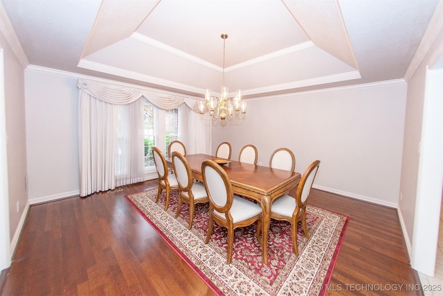 8734 S Richmond Ave, Tulsa, OK 74137 - dining space with a raised ceiling, a chandelier, wood finished floors, and baseboards