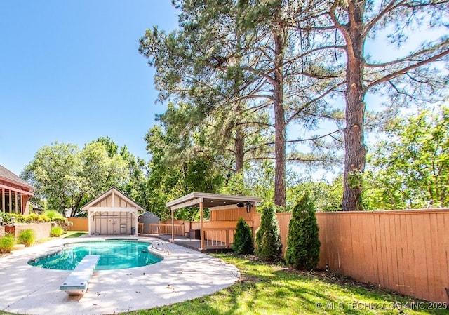 8734 S Richmond Ave, Tulsa, OK 74137 - view of pool featuring a fenced backyard, a diving board, a deck, and a patio area
