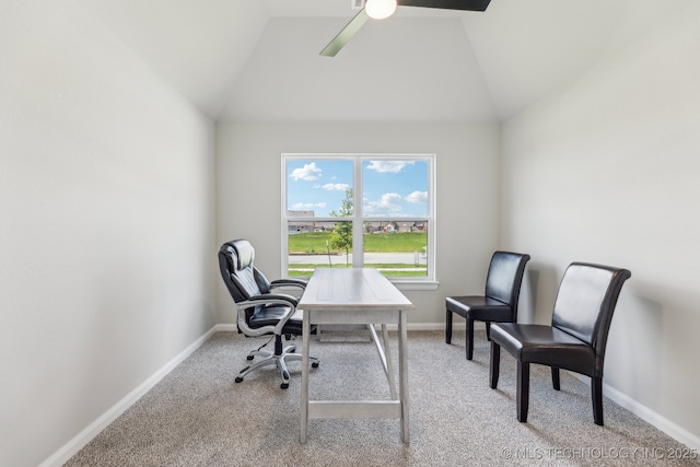 office featuring lofted ceiling, light carpet, baseboards, and ceiling fan