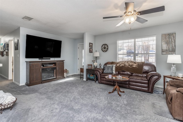 10862 Hide-A-Way, Thackerville, OK 73459 - carpeted living area with ceiling fan and baseboards