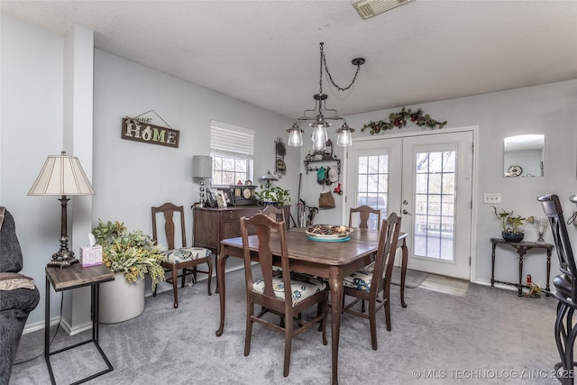 10862 Hide-A-Way, Thackerville, OK 73459 - dining room with light carpet, french doors, a textured ceiling, and baseboards