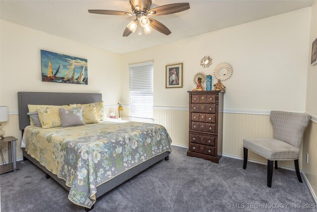 10862 Hide-A-Way, Thackerville, OK 73459 - bedroom featuring carpet floors, a wainscoted wall, and a ceiling fan