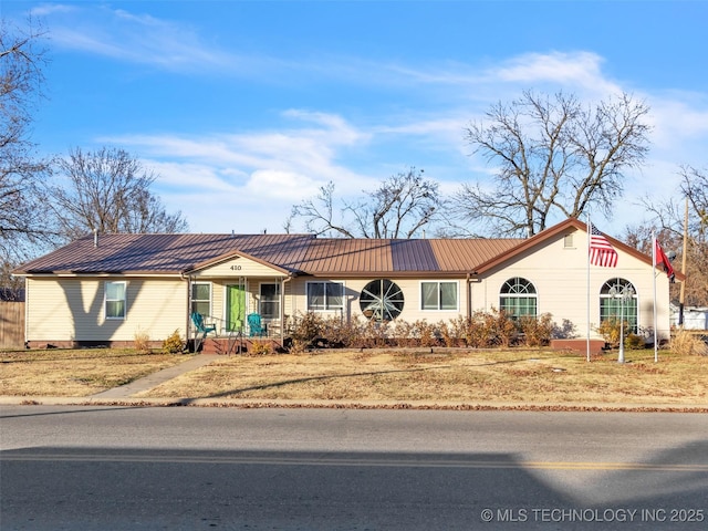 410 W B J Tunnell, Miami, OK 74354 - ranch-style home with metal roof and covered porch