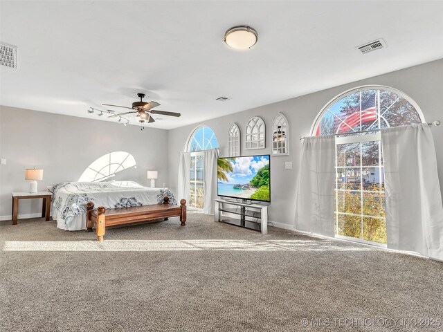 410 W B J Tunnell, Miami, OK 74354 - bedroom with carpet flooring, baseboards, and ceiling fan