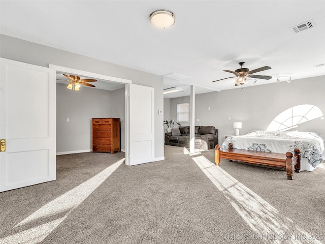 410 W B J Tunnell, Miami, OK 74354 - carpeted bedroom featuring a ceiling fan and baseboards