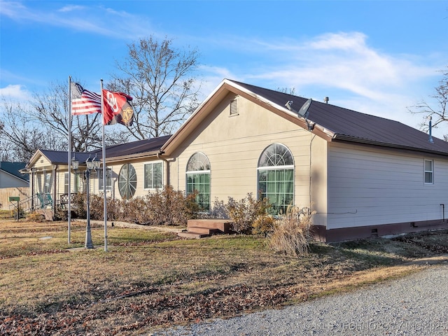 410 W B J Tunnell, Miami, OK 74354 - ranch-style house featuring metal roof