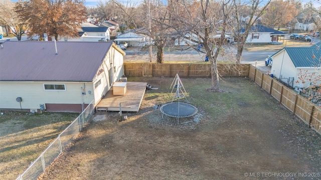 410 W B J Tunnell, Miami, OK 74354 - fenced backyard featuring a deck and a residential view