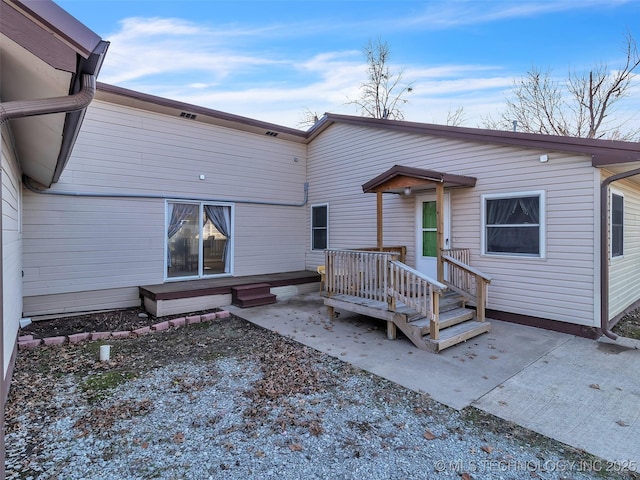 410 W B J Tunnell, Miami, OK 74354 - back of house with a patio