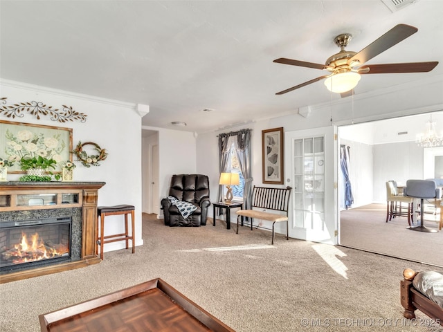 410 W B J Tunnell, Miami, OK 74354 - carpeted living area with ceiling fan, ornamental molding, and a glass covered fireplace