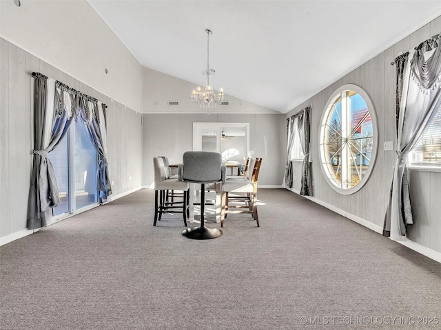410 W B J Tunnell, Miami, OK 74354 - carpeted dining area with a chandelier, vaulted ceiling, and baseboards