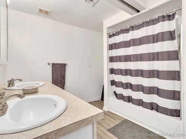 410 W B J Tunnell, Miami, OK 74354 - full bath featuring wood finished floors, double vanity, and shower / bathtub combination with curtain