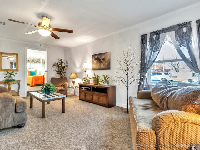 410 W B J Tunnell, Miami, OK 74354 - living room featuring light carpet, ceiling fan, baseboards, and crown molding