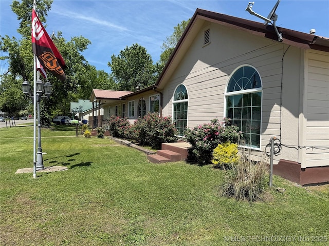 410 W B J Tunnell, Miami, OK 74354 - back of property with a lawn