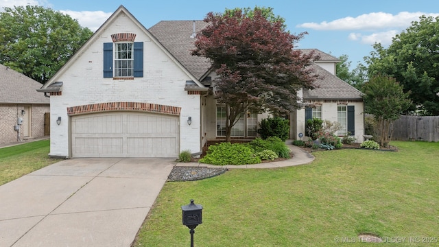 7204 E 92nd St, Tulsa, OK 74133 - view of front of property with a garage, concrete driveway, brick siding, and a shingled roof