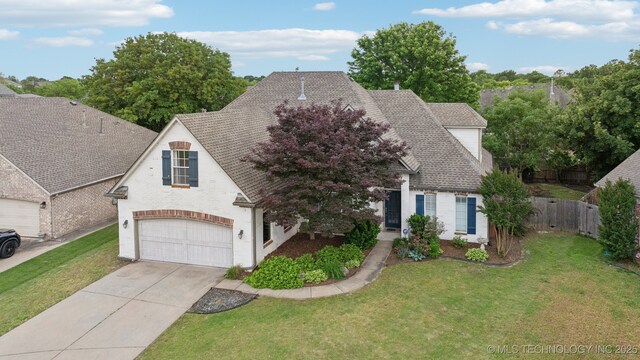 7204 E 92nd St, Tulsa, OK 74133 - view of front facade featuring concrete driveway, a garage, and roof with shingles