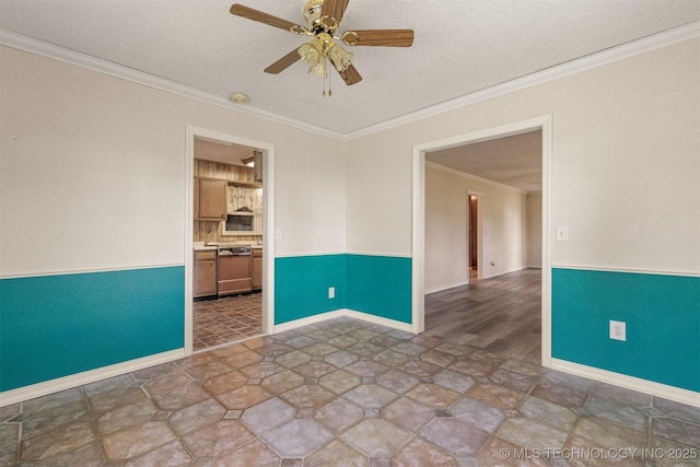 spare room featuring ceiling fan, crown molding, a textured ceiling, and baseboards