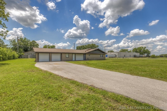 ranch-style home with a garage and concrete driveway