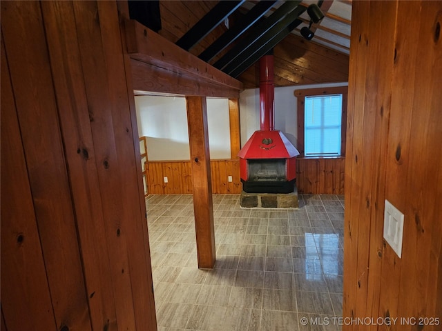 1435 E Oak St, Cushing, OK 74023 - bonus room featuring a wood stove, wood walls, and wood ceiling