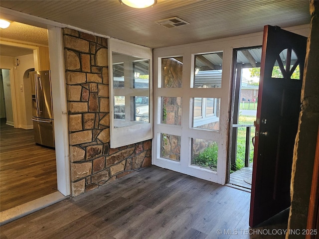 1435 E Oak St, Cushing, OK 74023 - doorway to outside with dark wood-style flooring