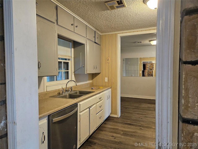 1435 E Oak St, Cushing, OK 74023 - kitchen featuring stainless steel dishwasher, a textured ceiling, a sink, dark wood-style flooring, and light countertops