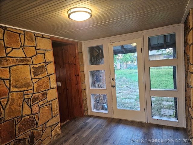 1435 E Oak St, Cushing, OK 74023 - doorway to outside featuring dark wood-style floors, wooden ceiling, and healthy amount of natural light