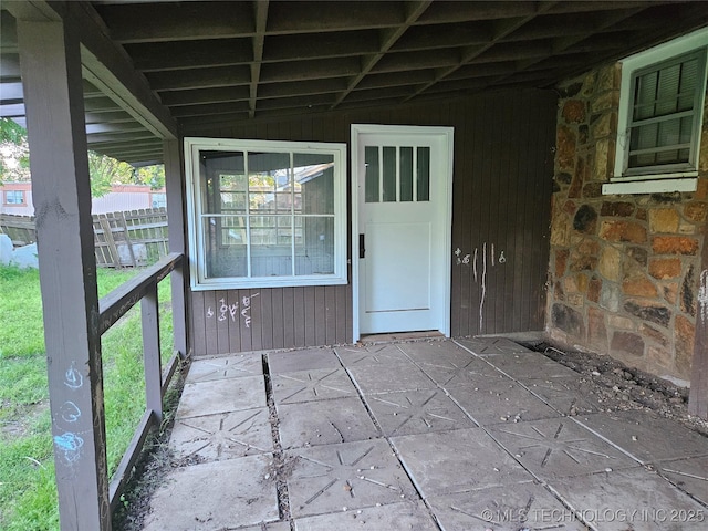 1435 E Oak St, Cushing, OK 74023 - doorway to property with stone siding and fence