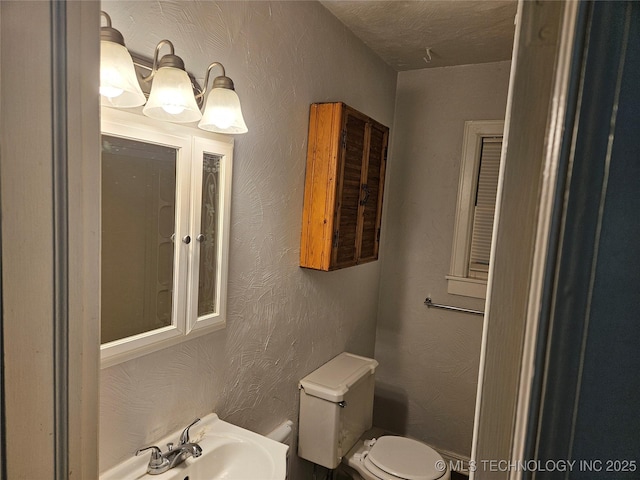 1435 E Oak St, Cushing, OK 74023 - bathroom with toilet and a sink