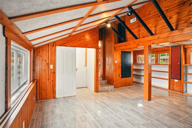 1435 E Oak St, Cushing, OK 74023 - unfurnished living room featuring wooden walls