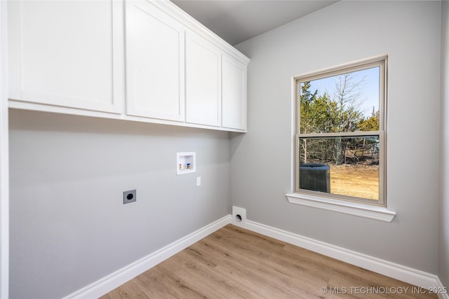 250 Maple Leaf Dr, Durant, OK 74701 - laundry area with electric dryer hookup, cabinet space, baseboards, light wood-type flooring, and washer hookup