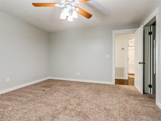 unfurnished room featuring carpet, ceiling fan, and baseboards