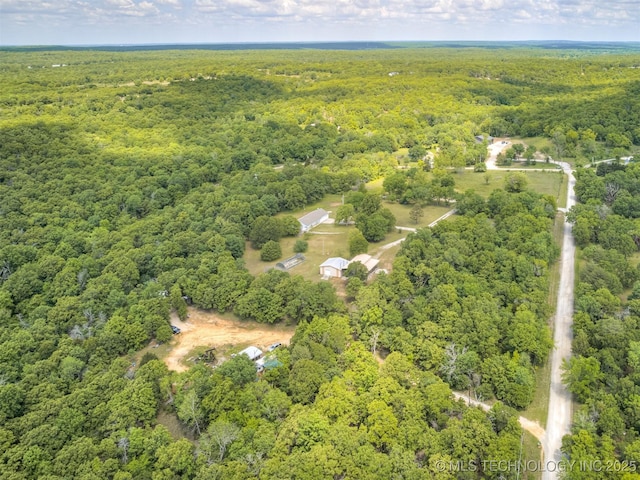 aerial overview of property's location featuring a forest
