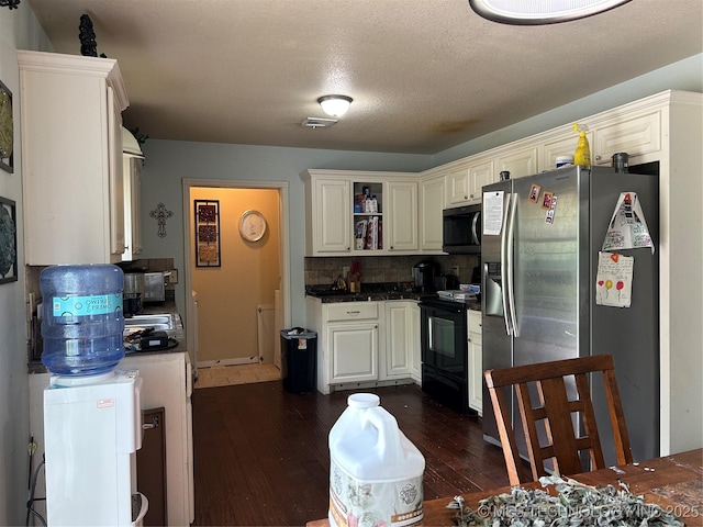 kitchen with stainless steel fridge with ice dispenser, black electric range, dark wood finished floors, decorative backsplash, and dark countertops