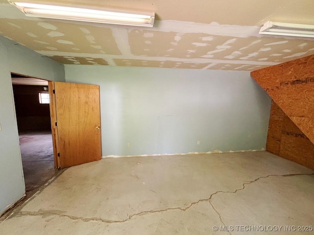 303 NW 3rd St, Stigler, OK 74462 - spare room featuring unfinished concrete floors