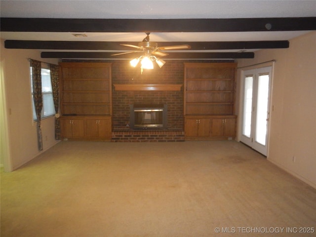 110 W 8th St, So Coffeyville, OK 74072 - unfurnished living room featuring beamed ceiling, light colored carpet, ceiling fan, a fireplace, and baseboards