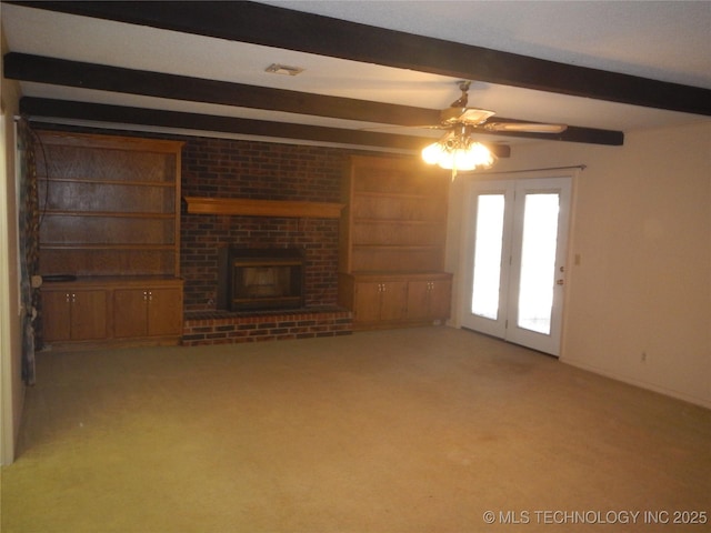 110 W 8th St, So Coffeyville, OK 74072 - unfurnished living room featuring beamed ceiling, a ceiling fan, carpet, and a fireplace