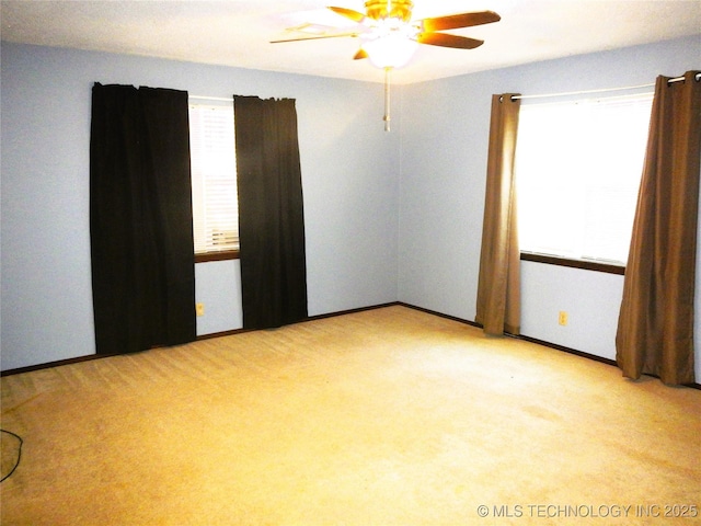 110 W 8th St, So Coffeyville, OK 74072 - carpeted empty room with a ceiling fan and baseboards