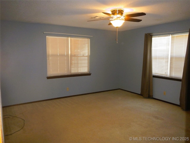 110 W 8th St, So Coffeyville, OK 74072 - unfurnished room with a ceiling fan, light colored carpet, and baseboards