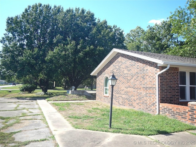 110 W 8th St, So Coffeyville, OK 74072 - view of property exterior with brick siding