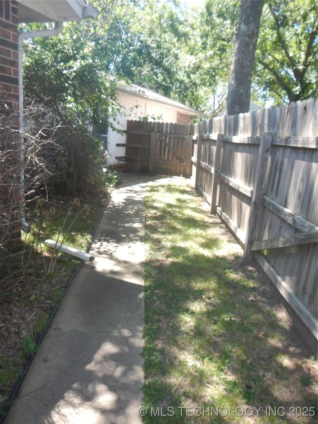 110 W 8th St, So Coffeyville, OK 74072 - view of yard with fence
